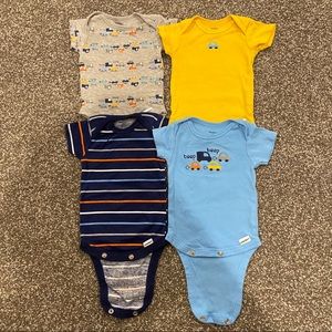 A bundle of 4 0-3 month onesies